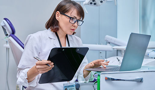 Dental patient reading a dental newsletter